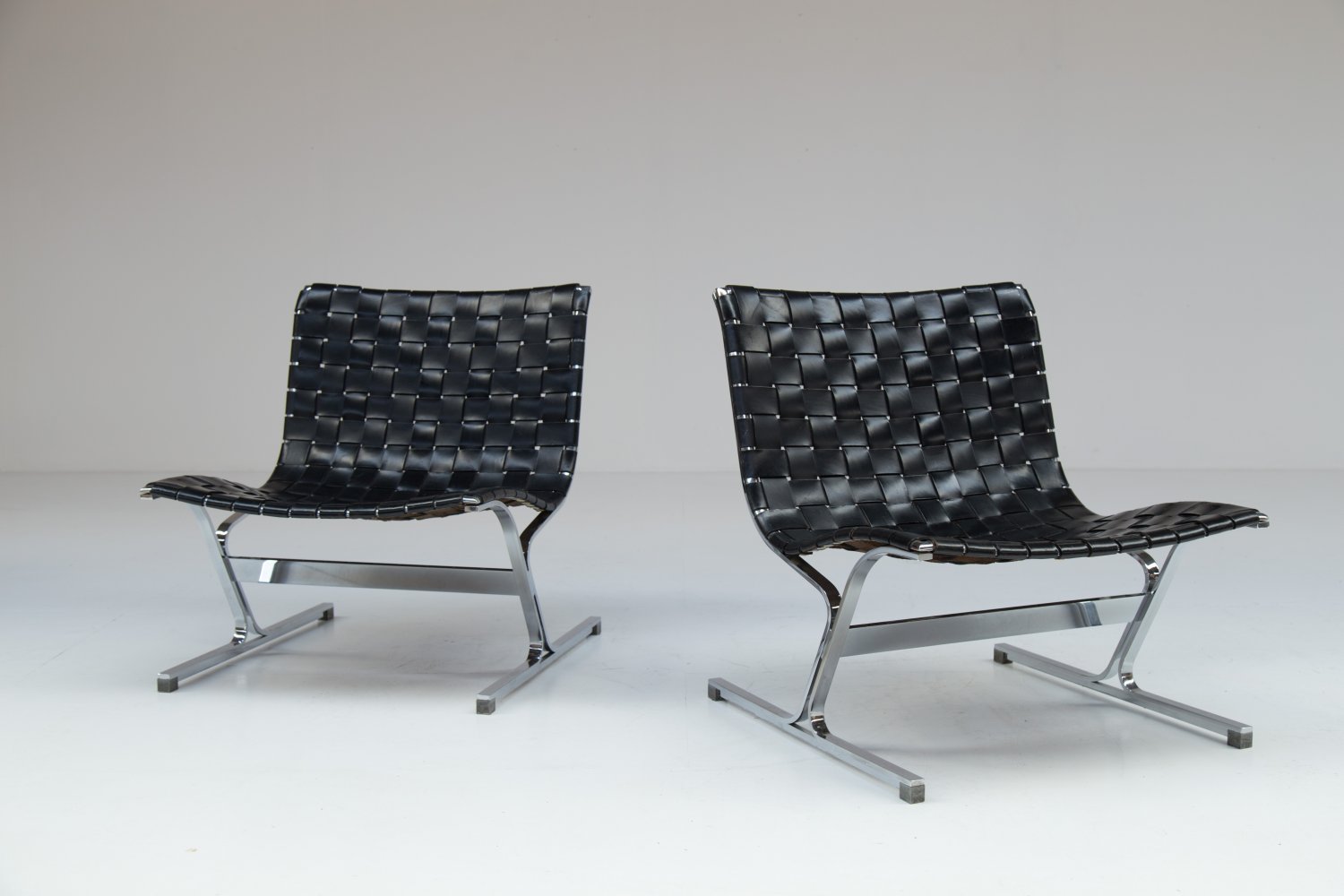 Pair of black leather 'Luar' chairs by Ross Litell 