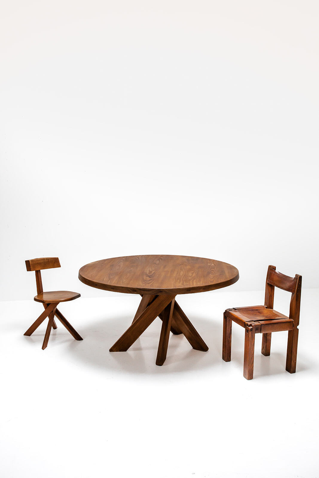 Round dining table by Pierre Chapo